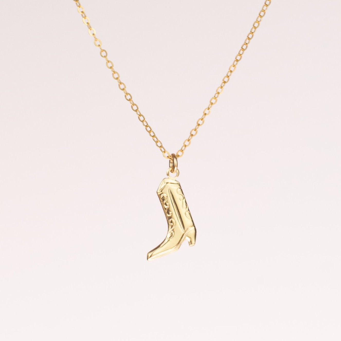 Every cowgirls' lucky charm 🍀 You will get so many compliments for this necklace honey. Charm and necklace made from 14k gold filled. | Cowboy Boot Necklace | Buy Fun Jewelry | HolaAmorEstudios | 